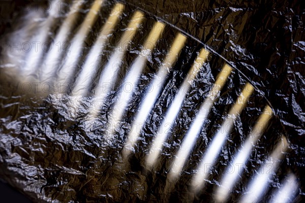 Car Grille on the Front of a an Old Classic Car Covered with Plastic Protection in Switzerland