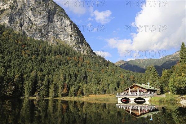 The picturesque Pflegersee lake near Garmisch, with the mountain inn in the background