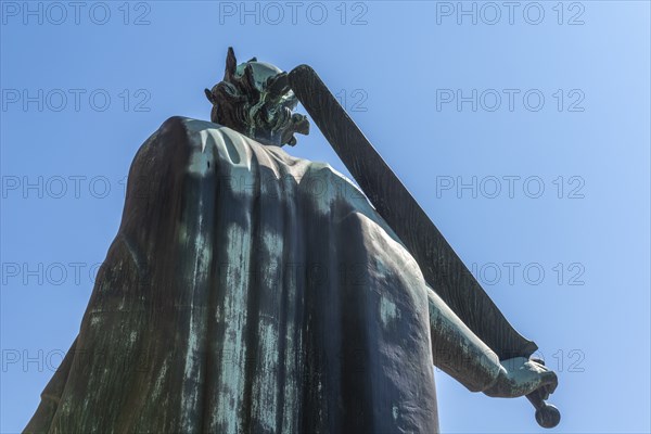 Odense, King Knud statue, crown, sword, tower of the cathedral church, Fyn, island of Funen,