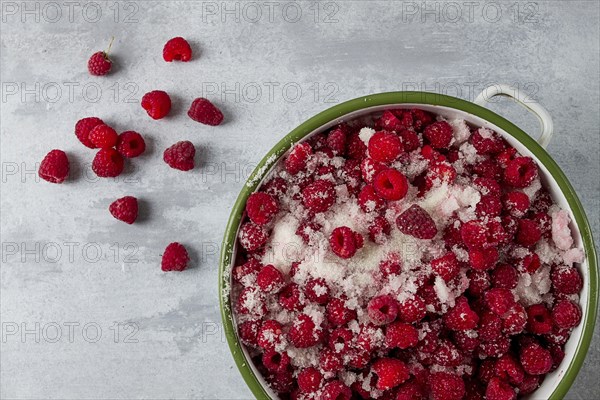 Fresh raspberry berry, covered with granulated sugar, jam preparation, top view, no people