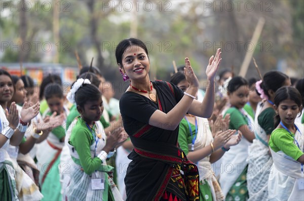 An instructor dance Bihu, as she teach participants during a Bihu dance workshop, ahead of Rongali