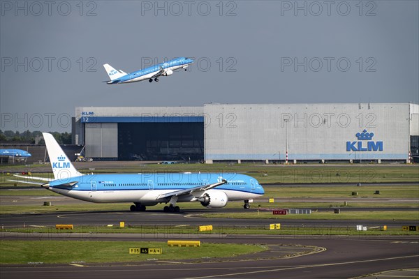 Amsterdam Schiphol Airport, aeroplanes on the taxiway, KLM aircraft taking off from the