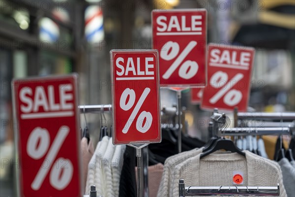 Sale, special offers of a clothing shop in the pedestrian zone, in Duisburg, North