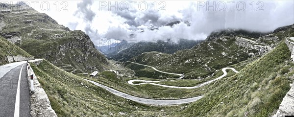 Panorama photo with HDR effect of winding pass road to Alpine pass Colle del Col de Nivolet, low