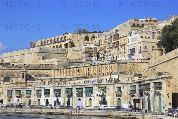 Historic waterfront buildings on Grand Harbour waterside, Valletta, Malta, Europe