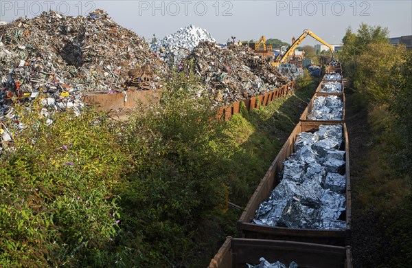 Scrap metal recycling loading train wagons with processed metals, EMR company, Swindon, England, UK