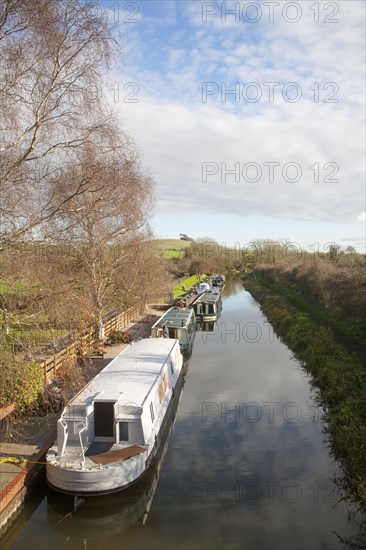 Narrowboats moored on the Kennet and Avon canal at Honey Street, Vale of Pewsey, Wiltshire,