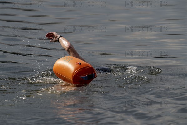 Open water swimmer, with marker buoy, in a lake, Wambachsee, 6-Seen-Platte, Duisburg, North