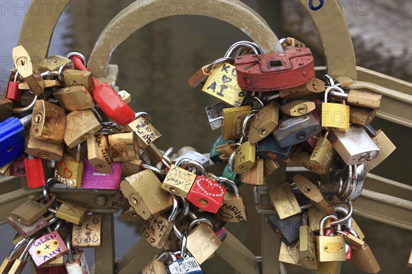 Lover's lock on a railing, love lock is a padlock which, according to custom, is attached to