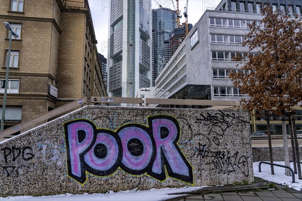 Winter in Frankfurt, view of the city skyline, graffiti on a wall at the theatre tunnel, Poor,