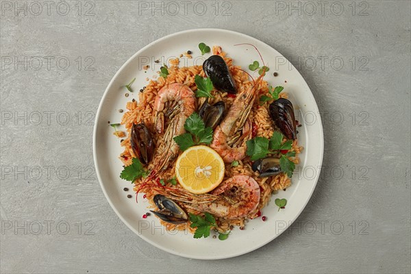 Seafood paella, shrimp and mussels risotto, rice, homemade, top view, no people
