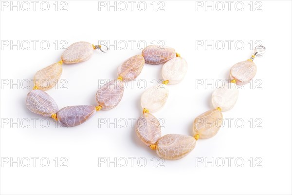Dragon vein agate colored beads isolated on white background. top view, close up