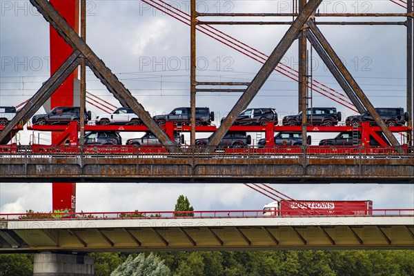 The Beeckerwerther Rhine bridge of the A42 motorway, truck traffic, in front of it the Haus-Knipp