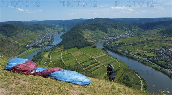 Paraglider ready, view over the river landscape and green hills, paragliding, Bremm, Cochem,