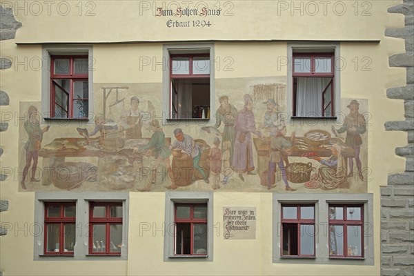 Historical mural with fish market scene, medieval building, inscription, year, market, market