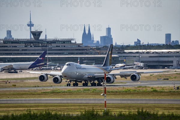 Cologne-Bonn Airport, CGN, UPS cargo aircraft, Boeing 747 jumbo jet, on landing, tower at the