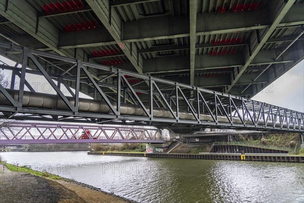 Dilapidated A42 motorway bridge (red arches) over the Rhine-Herne Canal, with massive structural
