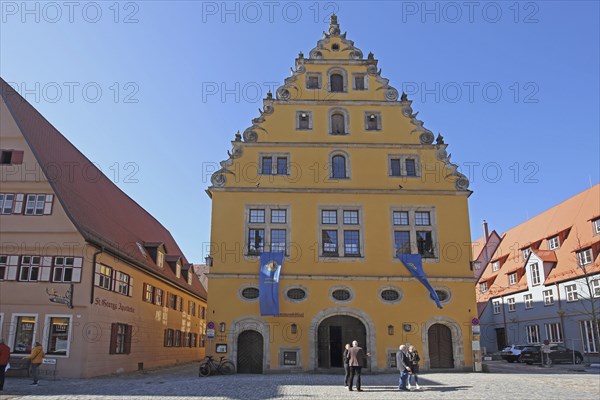Former municipal lock-up, yellow building with tail gable, people, Dinkelsbühl, Middle Franconia,