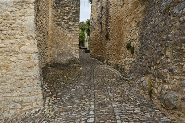 Natural stone walls and paths in La Roque-sur-Cèze, Département Gard, Occitanie region, France,