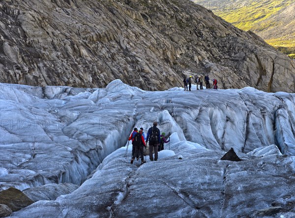 Hikers on a glacier trek on the Great Aletsch Glacier, UNESCO World Heritage Swiss Alps
