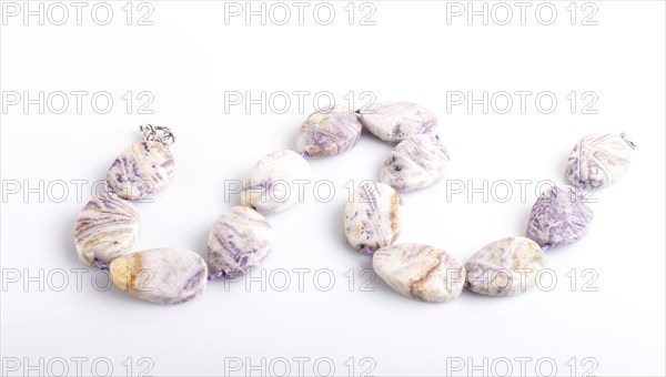 Agate colored beads isolated on white background. top view, close up