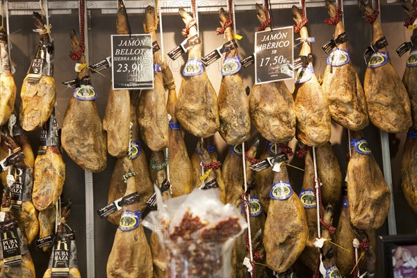 Close up display of cured hams inside a specialist shop in Barrio Macarena, Seville, Spain, Europe