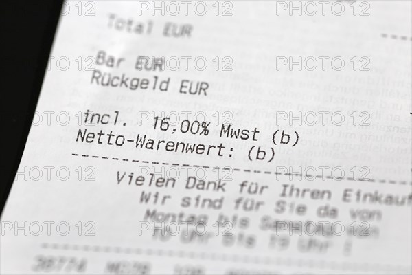 Close-up of a till receipt showing the reduction in VAT to sixteen per cent in Germany due to the