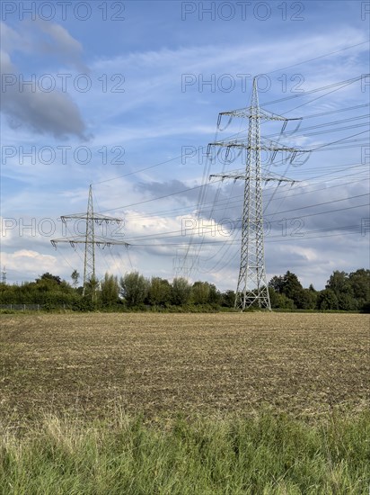 Two overhead line pylons High-voltage pylons Power pylons Support pylons Suspension of electrical