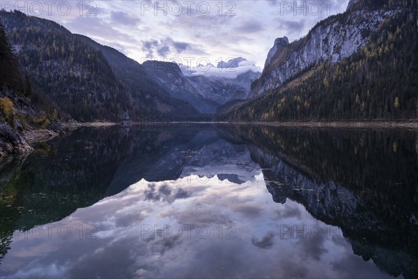 The Vordere Gosausee lake in the morning in autumn with a view of the Dachstein mountain range. The