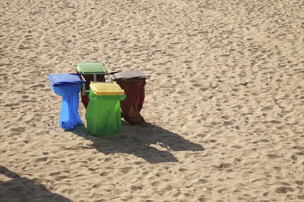 Rubbish bins on the sandy beach
