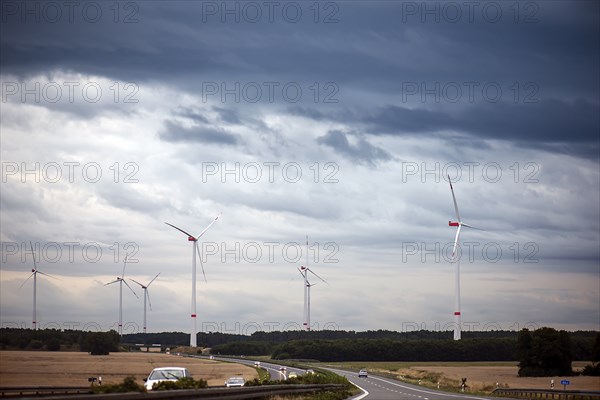 Wind turbines on the A 9 motorway, cloudy sky, Thuringia, Germany, Europe