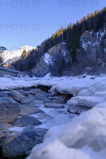 Inn or En near Scuol in winter, with ice floes, Engadin, Grisons, Switzerland, Europe