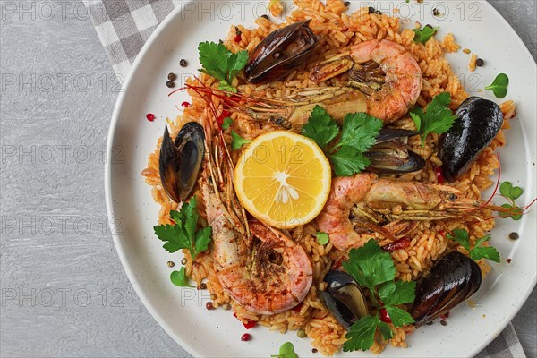 Seafood paella, shrimp and mussels risotto, rice, homemade, top view, no people