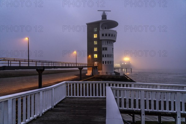 Thick fog in winter, hanging over the mouth of the Elbe into the North Sea, radar tower of the