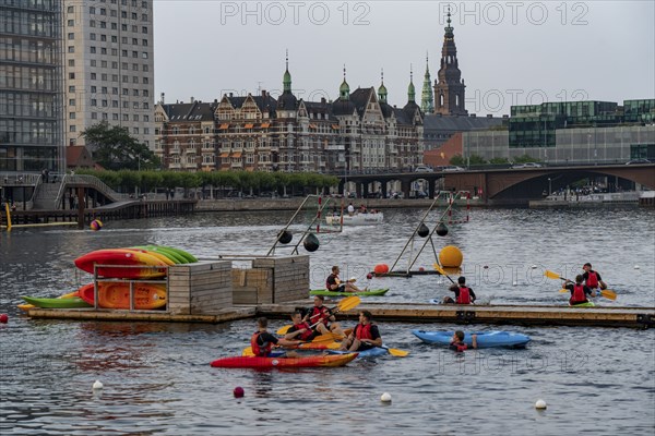 Summer evening in Copenhagen, at the harbour, Islands Brygge, people celebrating, eating, drinking,