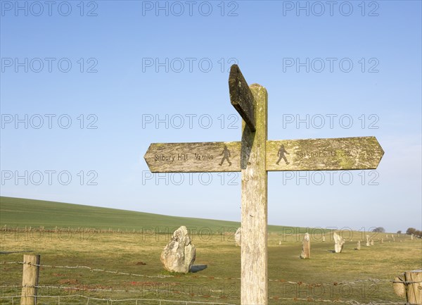 Wooden footpath signpost at the Avenue, Avebury World Heritage site, Wiltshire, England, UK