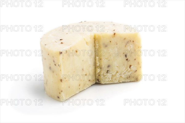 Piece of cheddar cheese isolated on white background. Side view, close up
