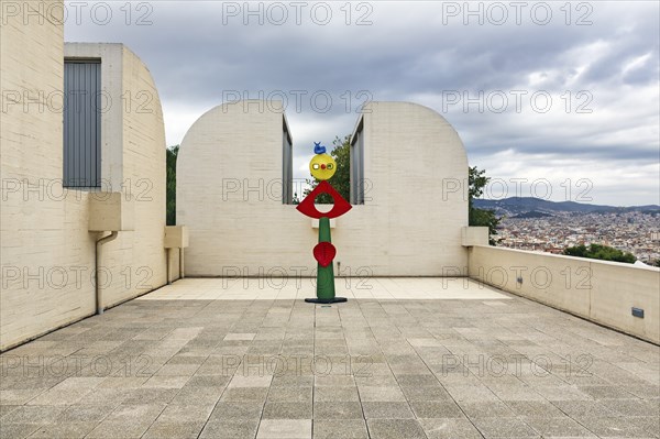 Colourfully painted bronze statue on a roof terrace, La carícia d'un ocell, Museum Fundacio Joan