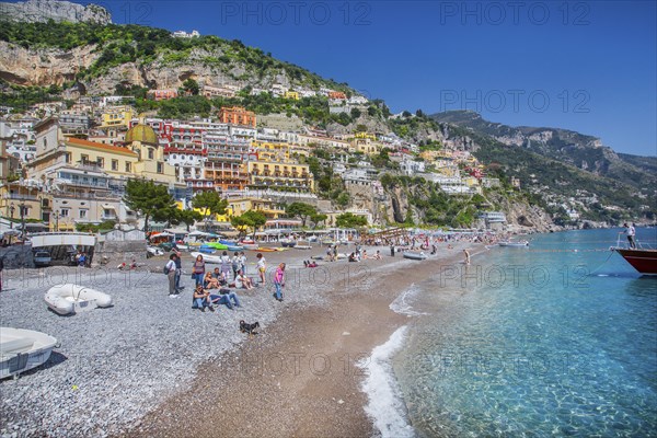 Beach with panoramic view of the village on the cliffs above the sea, Positano, Amalfi Coast,