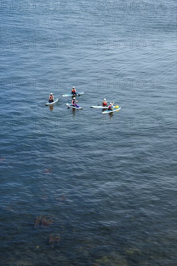 People on paddleboards, White Cliffs. Old Harry Rocks Jurassic Coast, Dorset Coast, Poole, England,