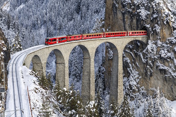 Rhaetian Railway train at the famous Landwasser Viaduct on the Albula railway Stadler Rail