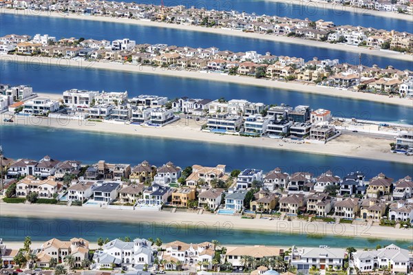 Artificial island in the shape of a palm tree The Palm Jumeirah with luxury villas and beachfront