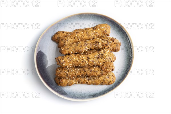 Crumble cookies with seasme and almonds on ceramic plate isolated on white background. top view,