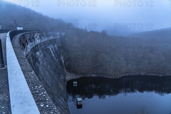 The dam wall of the Urft dam, in the Eifel, reservoir, in winter, fog, near Schleiden, North