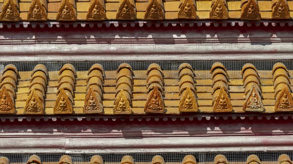 Roof decoration at the Uposatha Hall, Ubosot, the roof is staggered in three tiers and covered with