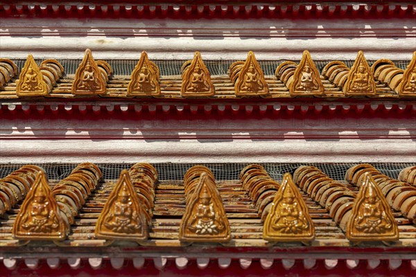 Roof decoration at the Uposatha Hall, Ubosot, the roof is staggered in three tiers and covered with