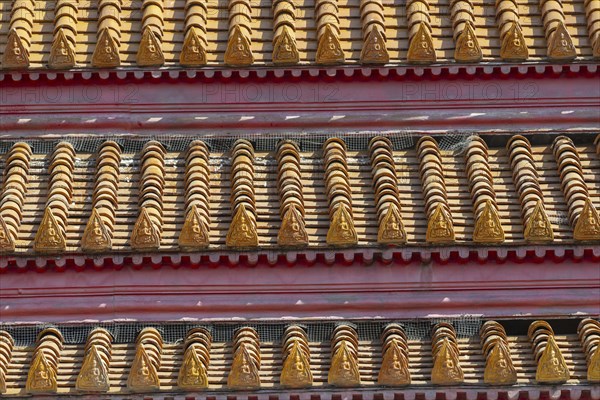 Roof decoration at the Uposatha Hall, Ubosot, the roof is staggered in three tiers and covered with