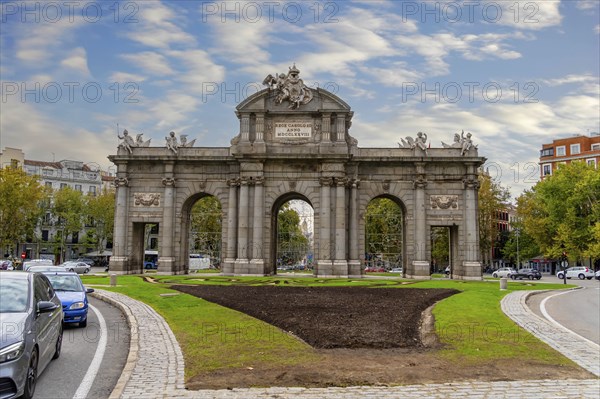 The Puerta de Alcalá is a Neo-classical gate in the Plaza de la Independencia in Madrid, Spain,