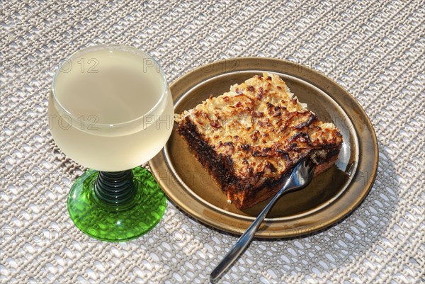 Zwiebelkuchen and Federweisser - onion pie and fermented wine must, a traditional dish in the Rhine
