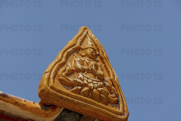 Roof decoration at the Uposatha Hall, Ubosot, the roof is staggered in three tiers and covered with